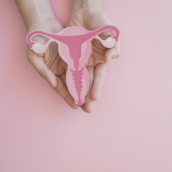a hand holding a cut out of a paper