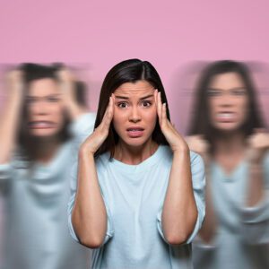a woman with her hands on her head