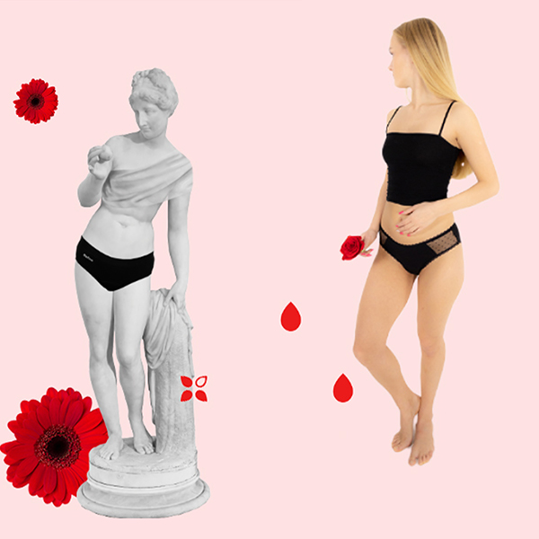 a woman in underwear and a statue
